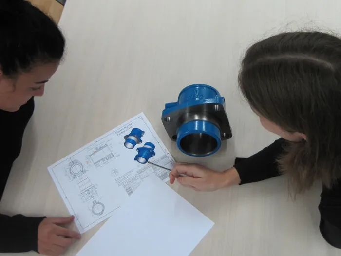 INAMESA technical office with a machined part and its drawing
